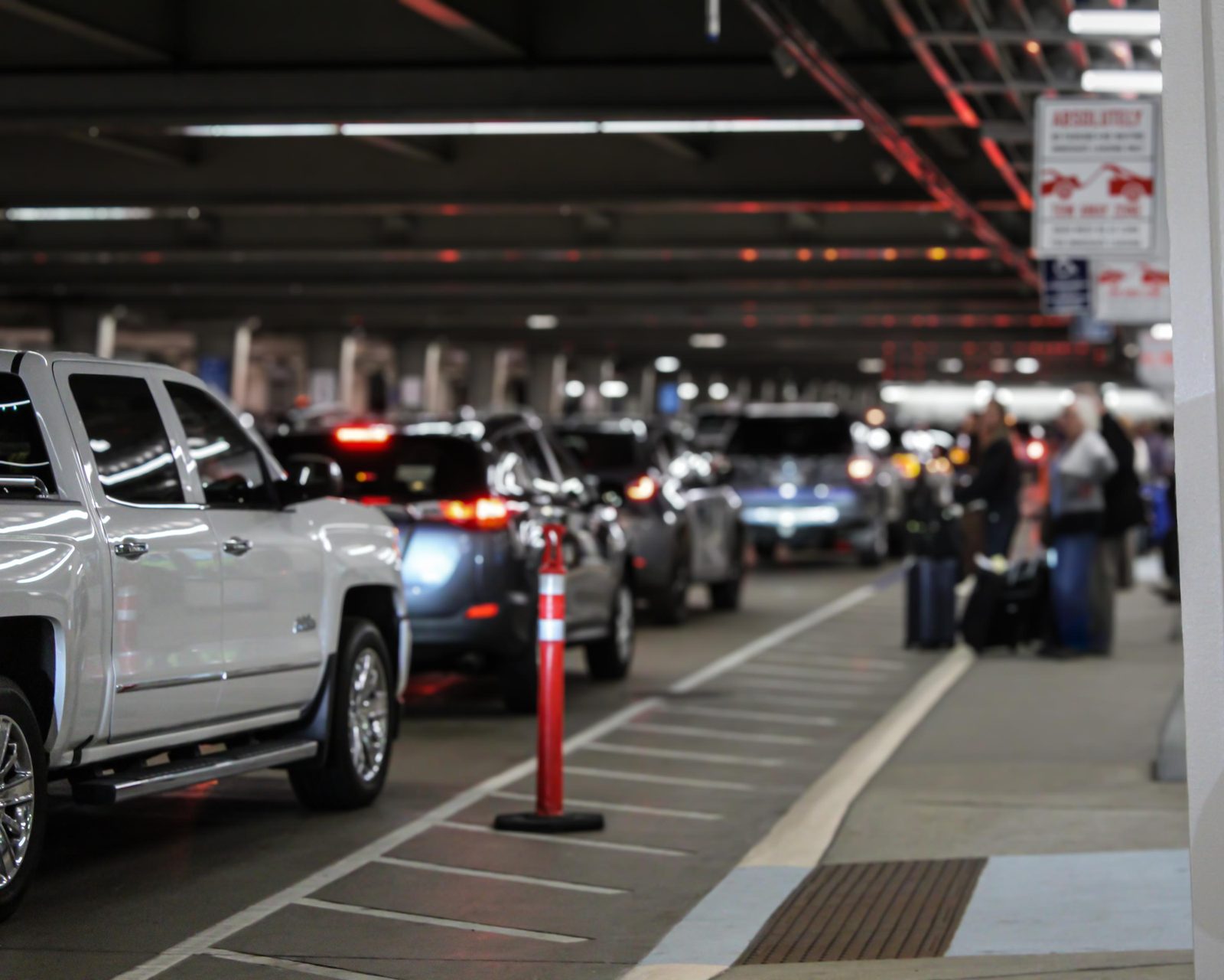 Airport arrivals curb with cars waiting